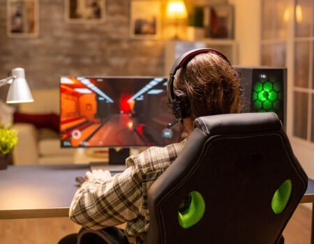 back view gamer male playing shooter