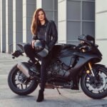 beautiful biker girl wearing black leather jacket
