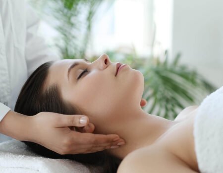 lying woman receiving massage craniosacral therapy