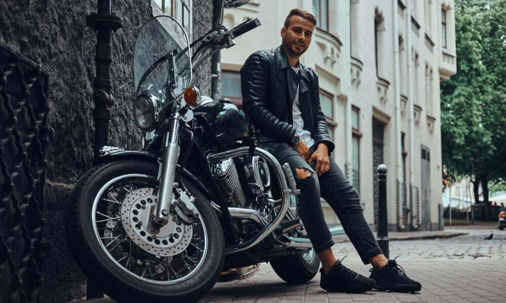 fashionable biker dressed black leather
