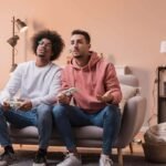 male friends playing with joystick 23 2148405655